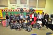 TCG Distributes Backpacks Filled With Toys and School Supplies to...